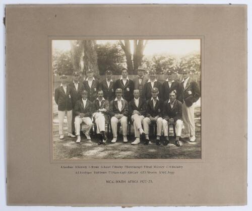 M.C.C. tour of South Africa 1922/23. Original sepia photograph of the M.C.C. touring team to South Africa 1922/23, standing and seated in rows wearing cricket attire and tour blazers, some in caps. Players featured are Mann (Captain), Gilligan, Fender, Ca
