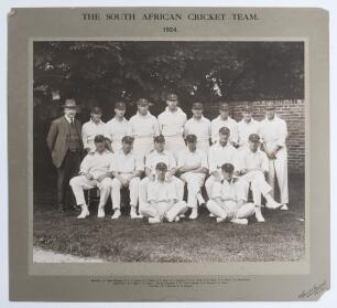&lsquo;The South African Cricket Team 1924&rsquo;. Large and impressive sepia photograph of the South African touring team to England in 1924, seated and standing in rows, wearing cricket attire and tour caps. The photograph is laid down to official photographers mou