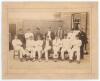 Surrey C.C.C. 1886. Early original sepia photograph of the Surrey team and officials seated and standing in rows, the players wearing cricket attire, caps, some in blazers. The photograph taken prior to their match against Nottinghamshire, 14th June 1886.