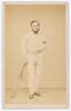 Robert Pearson Carpenter. Cambridgeshire & United England 1861-1876. Rare and early original sepia carte de visite studio photograph of Carpenter standing full length wearing cricket attire including spotted shirt, leaning on a bat. The card with printed 