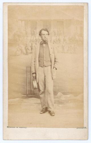 Henry Royston. M.C.C. & Middlesex 1843-1862. Rare and early original sepia carte de visite studio photograph of Royston standing full length wearing coat and bow tie, hat in hand. The card with printed title to verso for the photographer McLean & Haes of 