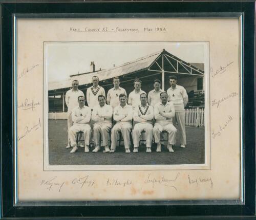&lsquo;Kent County XI Folkestone May 1954&rsquo;. Original mono photograph of the Kent team seated and standing in rows wearing cricket attire. The photograph measures 8.5&rdquo;x6.5&rdquo;, laid to mount. Signed in ink to the mount borders by all eleven featured players. Signat