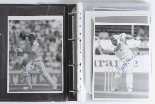 England 1980s/1990s. Brown binder comprising one hundred original mono and colour press photographs of England Test cricketers, of which fifteen are signed by the featured player. Signatures are David Gower, Graham Gooch, Martyn Moxon, Mike Atherton, Phil