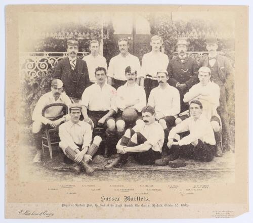 &lsquo;Sussex Martlets&rsquo; 1894. Early original sepia photograph of the Sussex Martlets football team seated and standing in rows in front of the pavilion wearing football attire for the match v Nottingham Forest hosted by the Earl of Sheffield at Sheffield Park, 