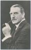 Charles Aubrey Smith. Cambridge University, Sussex, Transvaal & England 1882-1896. Mono real photograph studio portrait postcard of Smith, head and shoulders, dressed in formal suit smoking a pipe. Nicely signed in ink to darker part of the photograph by 