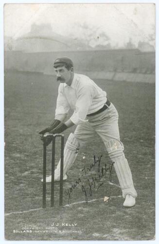 James Joseph Kelly. New South Wales & Australia 1894-1907. Early original mono postcard of Kelly in wicket-keeping pose wearing Australian Test cap. Printed title &lsquo;J.J. Kelly&rsquo;. Nicely signed in black ink to the image &lsquo;Yours truly, J.J. Kelly&rsquo;. T. Bolland,