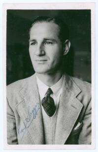 Ronald Arthur &lsquo;Ron&rsquo; Saggers. New South Wales & Australia 1939-1951. Mono real photograph plain back postcard of Saggers depicted head and shoulders wearing a suit and tie. Nicely signed in blue ink to the photograph by Saggers. Official stamp to verso for