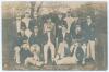 &lsquo;Australian Team 1902&rsquo;. Scarce and early sepia real photograph postcard of the 1902 Australian touring party to England, standing and seated in rows, wearing tour caps and blazers. Title to top and players named to lower border. Players include Darling (C