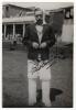 George Owen Dawkes. Leicestershire & Derbyshire 1937-1961. Original real photograph mono postcard of Dawkes, full length, wearing cricket attire and Derbyshire sweater. Nicely signed in ink to lower border &lsquo;George Dawkes&rsquo;. Series unknown. Postally unused.