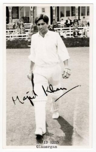 Majid Jahangir Khan. Lahore, Punjab, PIA, Glamorgan & Pakistan 1961-1985. Mono real postcard of Khan walking out to bat. Nicely signed by Khan in black ink. Title to lower border. &lsquo;C. Goodman of Newmarket&rsquo; postcard. Good/very good condition