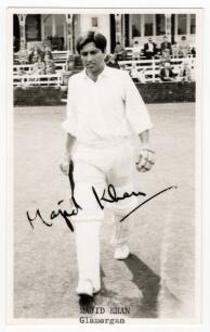 Majid Jahangir Khan. Lahore, Punjab, PIA, Glamorgan & Pakistan 1961-1985. Mono real postcard of Khan walking out to bat. Nicely signed by Khan in black ink. Title to lower border. &lsquo;C. Goodman of Newmarket&rsquo; postcard. Good/very good condition