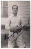Thomas Godfrey Evans. Kent & England 1939-1967. Mono real photograph plain back postcard of Evans standing three quarter length wearing wicket-keeping attire. Nicely and fully signed in black ink &lsquo;Thomas Godfrey Evans&rsquo; to the photograph. Printed title &lsquo;T.