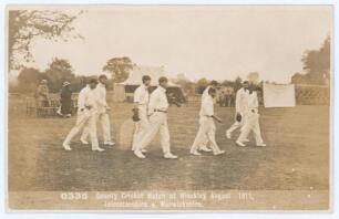 &lsquo;County Cricket Match at Hinckley August 1911, Leicestershire v Warwickshire&rsquo;. Rarer early sepia real photograph postcard of the Leicestershire team taking the field with sparse groups of spectators and marquee in the background. Printed title to lower bo