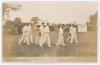 &lsquo;County Cricket Match at Hinckley August 1911, Leicestershire v Warwickshire&rsquo;. Rarer early sepia real photograph postcard of the Leicestershire team taking the field with sparse groups of spectators and marquee in the background. Printed title to lower bo