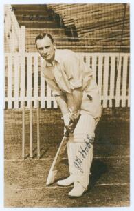 John Berry &lsquo;Jack&rsquo; Hobbs. Surrey & England 1905-1934. Original sepia real photograph postcard of Hobbs standing full length in batting pose in the nets. Nicely signed in ink to the photograph by Hobbs with greeting handwritten to top corner &lsquo;To F.G. Berkel