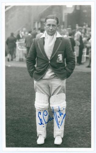 Stewart Cathie &lsquo;Billy&rsquo; Griffith. Cambridge University, Surrey, Sussex & England 1934-1954. Mono real photograph plain back postcard of Griffith standing full length wearing cricket attire and M.C.C. tour blazer. Nicely signed in blue ink to the photograph