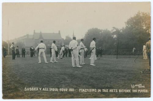 Sussex v All India Hove 1911. Rare and early sepia real photograph postcard with printed title &lsquo;Sussex v All India, Hove, 1911. Practising in the nets before the match&rsquo;. A group of players are seen waiting in turn to bowl in the nets prior to the match pl