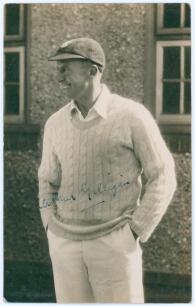 Arthur Edward Robert Gilligan. Cambridge University, Surrey, Sussex & England 1919-1932. Sepia real photograph postcard of Gilligan, three quarter length, wearing cricket attire and Sussex cap. Signed in ink to the photograph by Gilligan. Official stamp t