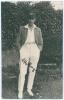 Reginald Allen &lsquo;Reg&rsquo; Hollingdale. Sussex 1925-1930. Mono real photograph postcard of Hollingdale standing full length wearing cricket attire, cap and blazer. Signed in ink to the photograph by Hollingdale. Printed title &lsquo;Hollingdale, R&rsquo;. Blind embossed st