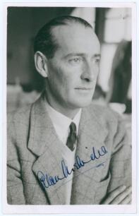 Alan Melville. Natal, Oxford University, Sussex, Transvaal & South Africa 1928-1949. Mono real photograph plain back postcard of Melville, head and shoulders wearing formal attire. Very nicely signed in ink to the photograph by Melville. Official stamp to