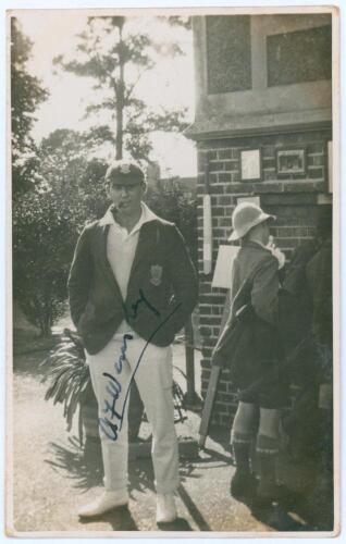 Albert Frederick &lsquo;Bert&rsquo; Wensley. Sussex, Auckland, Nawangar & Europeans 1922-1948. Mono real photograph postcard of Wensley standing full length behind a pavilion, smoking a pipe, wearing cricket attire, Sussex cap and blazer. Nicely signed in ink by Wens