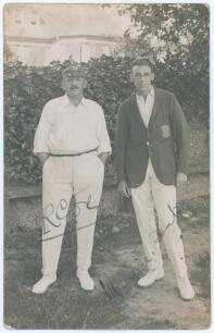 Sussex. George Cox and Maurice Tate. Mono real photograph postcard of George Rubens Cox (Sussex 1895-1928) and Maurice William Tate (Sussex & England 1912-1937) standing together full length wearing cricket attire, Cox with Sussex cap, Tate in Sussex blaz