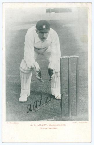 Arthur Frederick Augustus &lsquo;Dick&rsquo; Lilley. Warwickshire, London County & England 1894-1911. Early mono postcard of Lilley crouching at the stumps in wicket-keeping attire wearing Warwickshire cap. Printed title in red to lower margin. Nicely signed in black
