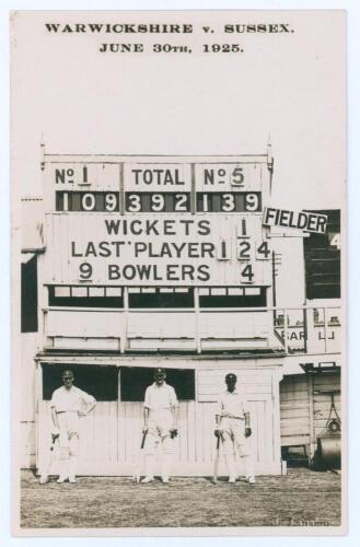 &lsquo;Warwickshire v. Sussex. June 30th 1925&rsquo;. Rarer real photograph postcard of the Warwickshire centurions, E.J. Smith (139no), J.H. Parsons (124) and F.S.G. Calthorpe (109no) standing full length wearing batting attire in front of the scoreboard at Edgbasto