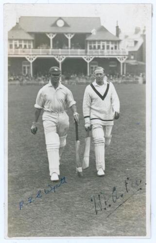 R.E.S Wyatt and W.E. Astill. Scarborough c.1928. Mono real photograph plain back postcard of Bob Wyatt (Warwickshire, Worcestershire & England 1923-1951) and Ewart Astill (Leicestershire & England 1906-1939) walking out to bat at Scarborough, the pavilion