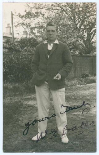 William Ederick &lsquo;Eddie&rsquo; Bates. Yorkshire & Glamorgan 1907-1931. Sepia real photograph postcard of Bates standing full length wearing cricket attire and blazer. Nicely signed in ink to the photograph &lsquo;Yours truly, W.E. Bates&rsquo;. Blind embossed stamp to lower