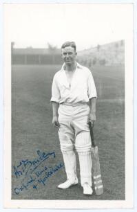 Alan Theodore Barber. Oxford University & Yorkshire 1927-1930. Mono real photograph plain back postcard of Barber standing full length wearing cricket attire, leaning on his bat. Nicely signed to the photograph in blue ink &lsquo;A.T. Barber. Oxford Univ. & Yor
