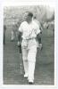 Paul Anthony Gibb. Yorkshire, Cambridge University, Essex & England 1935-1956. Mono real photograph plain back postcard of Gibb, full length wearing batting attire on the outfield at Scarborough in 1938. Very nicely signed in ink by Gibb to the photograph