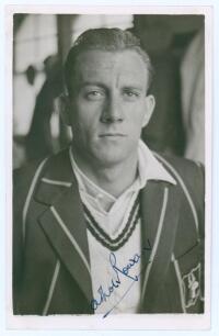 Athol Matthew Burchell Rowan. Transvaal & South Africa 1939-1951. Mono real photograph plain back postcard of Rowan, head and shoulders wearing tour blazer. Nicely signed in blue ink to the photograph by Rowan. Official stamp to verso for A. Wilkes & Son,