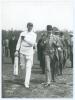 Charles Burgess Fry. Sussex, Hampshire, Oxford University, Europeans & England 1892-1922. Mono press photograph of C.B. Fry walking off the field of play wearing batting attire and England cap. Walking alongside him is Prince Albert of Schleswig Holstein 