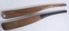 Replica early cricket bats. Two full size replica wooden cricket bats with sloping shoulders, made to represent bats from the 1700s. One with black stringed handle. Good condition.
