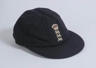 England dark blue cloth home Test cap. The cap with excellent raised embroidered emblem of three lions and crown of England to front. Internally appears to have been match worn and in good condition. Ownership unknown.