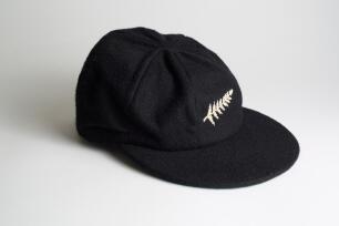 New Zealand black cloth Test cap, by Westminster, Freister, with embroidered &lsquo;silver fern&rsquo; emblem of New Zealand to cap. Appears match worn, good condition. Ownership unknown.