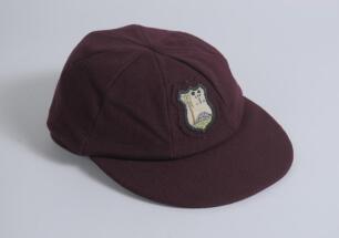 West Indies maroon cloth Test cap with embroidered and attached West Indian emblem to front. Appears match worn, good condition. Ownership unknown.