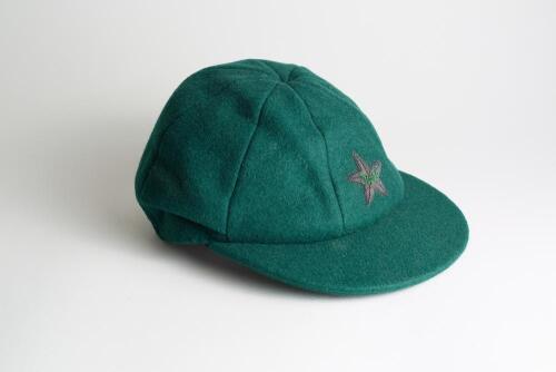 Pakistan green wool Test cap, by Shaheen Cap House of Karachi, with wired silver emblem of Pakistan to front of cap. Appears match worn, good condition. Ownership unknown.