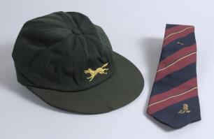 Leicestershire C.C.C. 1st XI players&rsquo; cap and James Whitaker benefit tie 1993. The cap is believed to have been Whitaker&rsquo;s but cannot be confirmed. The cap with crack to peak, otherwise in good condition. Qty 2.