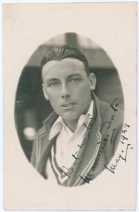 Maurice William Tate. Sussex & England 1912-1937. Mono real photograph postcard of Tate, head and shoulders in cameo, wearing M.C.C. touring blazer. Nicely signed in black ink to the photograph by Tate and dated &lsquo;May 1929&rsquo;. Albert Wilkes & Son, West Bromw
