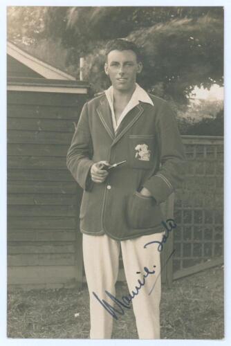Maurice William Tate. Sussex & England 1912-1937. Excellent mono real photograph postcard of Tate standing three quarter length wearing M.C.C. blazer and holding pipe. Very nicely signed in ink to the photograph by Tate. Official stamps to verso for Nias 