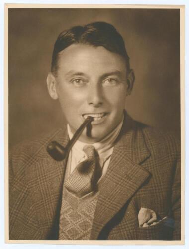 Maurice William Tate. Sussex & England 1912-1937. Excellent original sepia studio portrait photograph of Tate, head and shoulders wearing a suit and tie, pipe in his mouth. The photograph, with blind embossed stamp for Monte Luke Studio, 101 The Strand, S