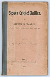 &lsquo;Sussex Cricket Battles&rsquo;. Alfred D. Taylor. &lsquo;Reprinted from the &ldquo;Hove Gazette&rdquo;&rsquo;, Emery & Son, Hove 1903. The original pink paper wrappers have been laid down to stiffened card with crude tape spine. The inside front board has a window cut in to reveal a d