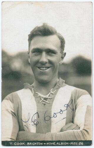 Thomas Edwin Reed &lsquo;Tommy&rsquo; Cook. Sepia real photograph plain back postcard of Cook head and shoulders wearing Brighton & Hove Albion football shirt. Printed title &lsquo;T. Cook, Brighton & Hove Albion 1925-26&rsquo;. Signed in ink to photograph by Cook. Brighton Cam
