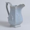 Cricket jug. A light blue mid 19th century Staffordshire salt-glaze jug, the hexagonal bulbous body divided into six panels with cricketers wearing top hats, probably Lillywhite, Pilch and Box. Above and below are stylised floral decorations and scrolled - 2