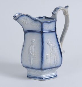 Cricket jug. A light blue mid 19th century Staffordshire salt-glaze jug, the hexagonal bulbous body divided into six panels with cricketers wearing top hats, being Pilch, Clarke and Box. The panels nicely highlighted in a darker cobalt blue. Above and bel