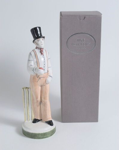 &lsquo;The Rye Bowler&rsquo;. Rye Pottery 2013. Tall figure of a bowler wearing a top hat, holding out a cricket ball, the figure based on William Lillywhite, who played for England, Sussex and Rye. The figure stands 11.5&rdquo; tall. Rye Pottery stamps to base with year 2