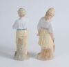 &lsquo;Young England and Young England&rsquo;s sister&rsquo;. A nice pair of continental bisque figures of a boy, wearing cream and blue hooped cap holding a cricket ball and a young girl, wearing a cream and pink hooped cap, dressed in three-quarter dress holding a cricke - 2