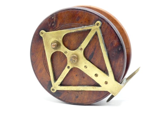 A Nottingham 7" walnut "diamond" back sea centre pin reel, brass backed drum with twin turned wooden handles on brass plates, recessed spindle well with wing locking nut, brass foot with diamond support stancheon and sliding optional check button, circa 1